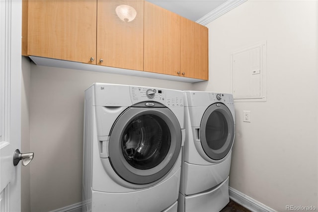 laundry area with ornamental molding, electric panel, independent washer and dryer, and cabinets