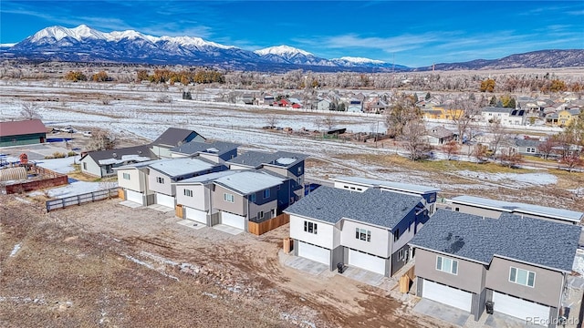 snowy aerial view with a mountain view