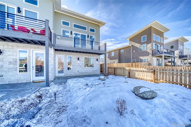 view of snow covered house