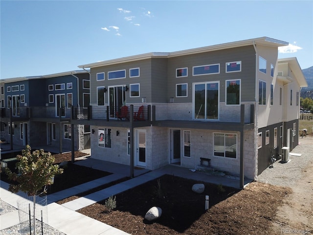 view of building exterior with central AC