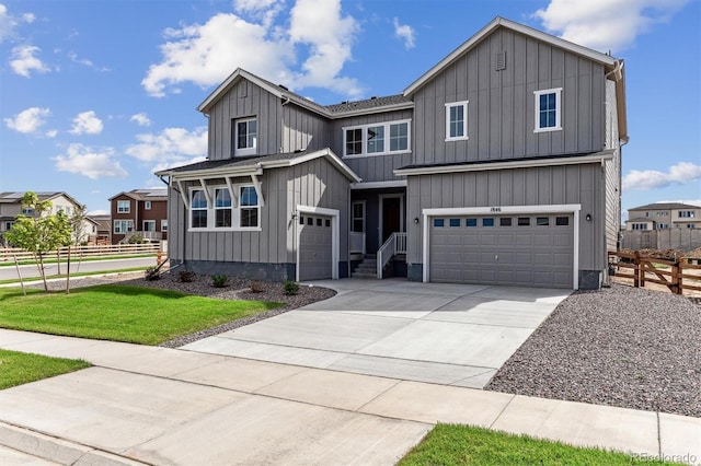 view of front of house featuring a garage and a front lawn