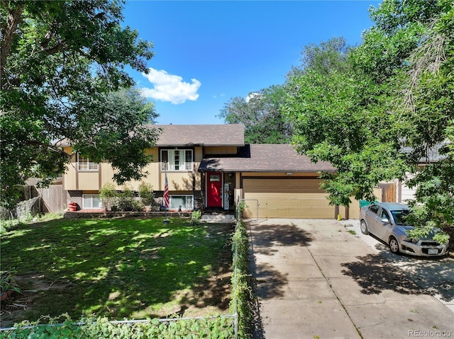 view of front of house with a garage, brick siding, concrete driveway, stucco siding, and a front lawn