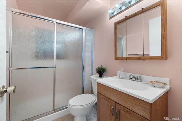 full bath featuring vanity, a shower stall, and toilet