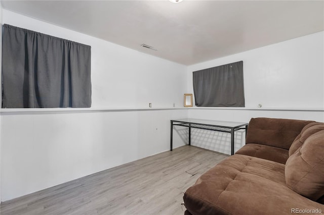 sitting room with wood finished floors and visible vents