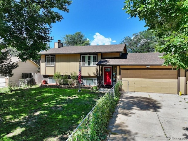 view of front of property featuring an attached garage, driveway, and a chimney