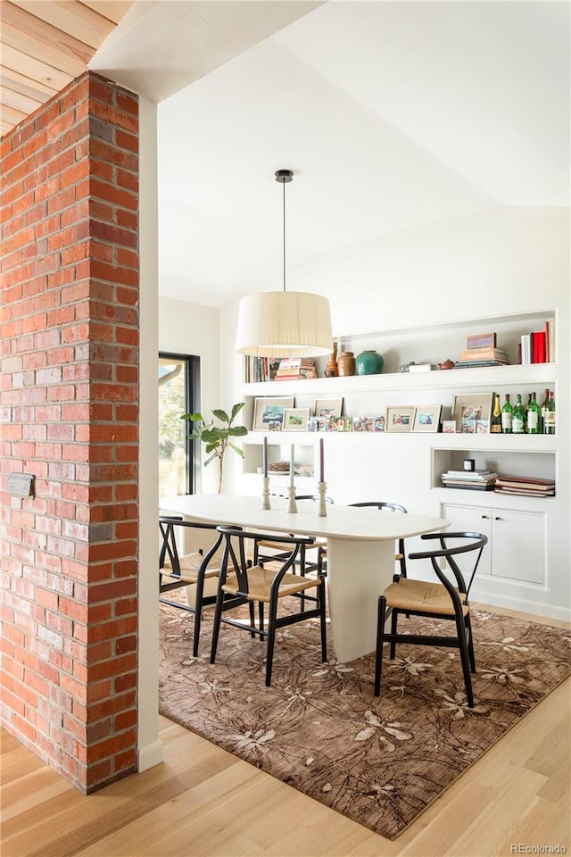 dining area with light wood-style flooring