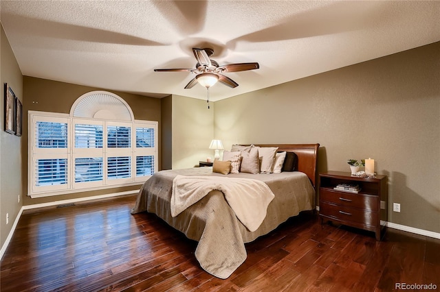 bedroom featuring ceiling fan and dark wood-type flooring