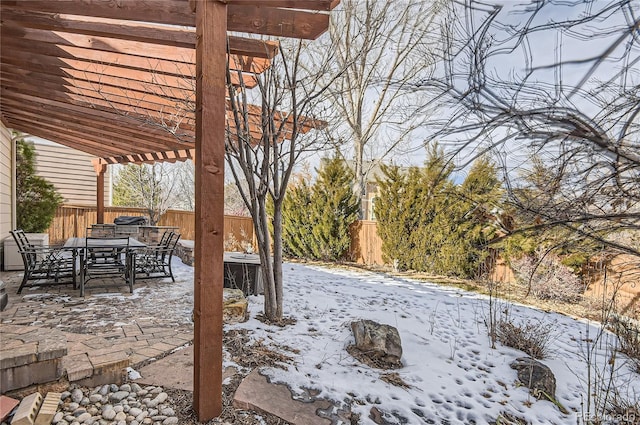 yard layered in snow featuring an outdoor fire pit, a pergola, and a patio