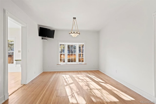 unfurnished dining area with light hardwood / wood-style floors