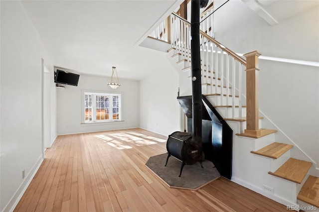 staircase with hardwood / wood-style floors