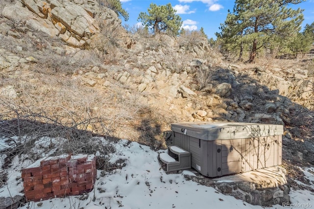 exterior details featuring a hot tub