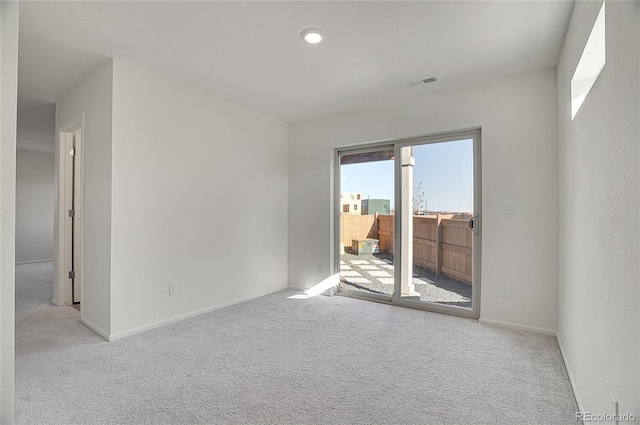 10124 Xanadu St, Commerce City, CO 80022 - empty room with visible vents, baseboards, recessed lighting, and light carpet