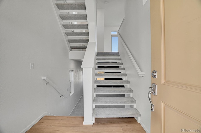 10124 Xanadu St, Commerce City, CO 80022 - stairway with wood finished floors and baseboards