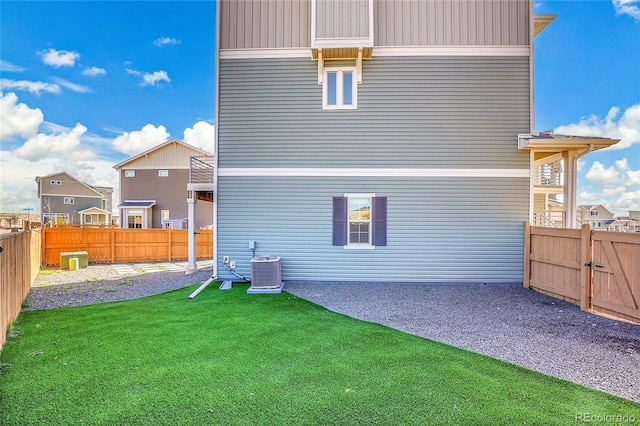 10124 Xanadu St, Commerce City, CO 80022 - rear view of house with a patio, a yard, a fenced backyard, and central AC