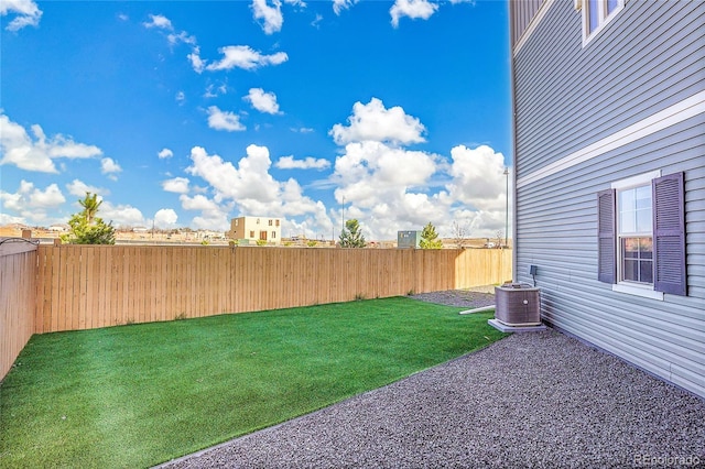 10124 Xanadu St, Commerce City, CO 80022 - view of yard featuring central AC unit and a fenced backyard