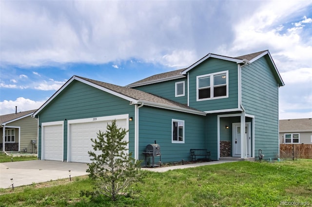 329 S 3rd Ave, Deer Trail, CO 80105 - traditional-style home with driveway, an attached garage, and a shingled roof