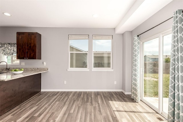 329 S 3rd Ave, Deer Trail, CO 80105 - unfurnished dining area featuring light wood-style floors and recessed lighting