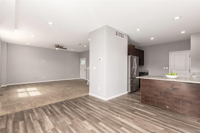 329 S 3rd Ave, Deer Trail, CO 80105 - kitchen with stainless steel fridge, wood finished floors, ceiling fan, recessed lighting, and dark brown cabinets