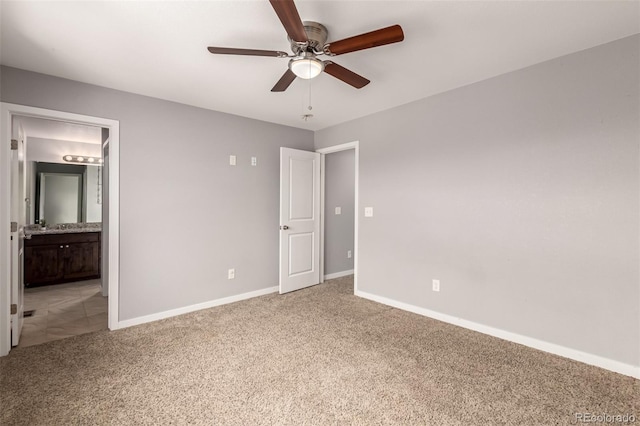 329 S 3rd Ave, Deer Trail, CO 80105 - unfurnished bedroom with carpet floors, connected bathroom, and ceiling fan