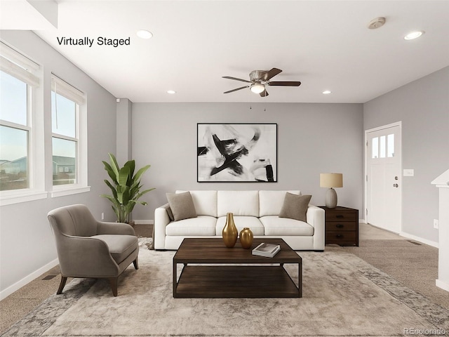 329 S 3rd Ave, Deer Trail, CO 80105 - carpeted living area with healthy amount of natural light, ceiling fan, and recessed lighting
