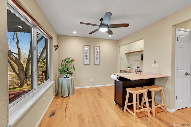 interior space featuring visible vents, ceiling fan, baseboards, recessed lighting, and light wood-style floors