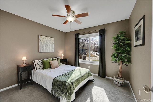 bedroom with a ceiling fan, baseboards, and carpet floors