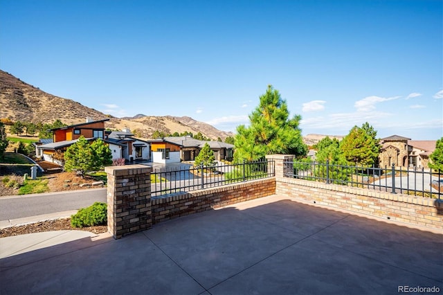 view of patio / terrace featuring a mountain view