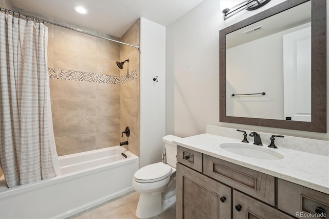 full bathroom with tile patterned floors, vanity, toilet, and shower / bath combo with shower curtain