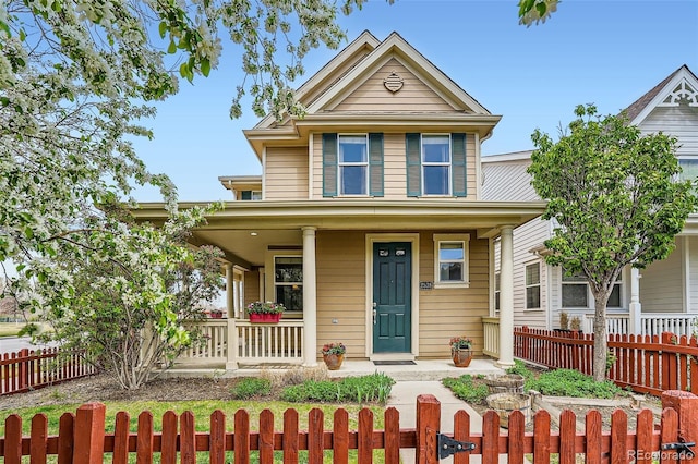 2538 Central Park Blvd, Denver, CO 80238 - view of front facade with a porch and a fenced front yard