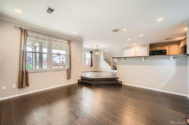 2538 Central Park Blvd, Denver, CO 80238 - living room with stairs, ornamental molding, recessed lighting, and dark wood finished floors