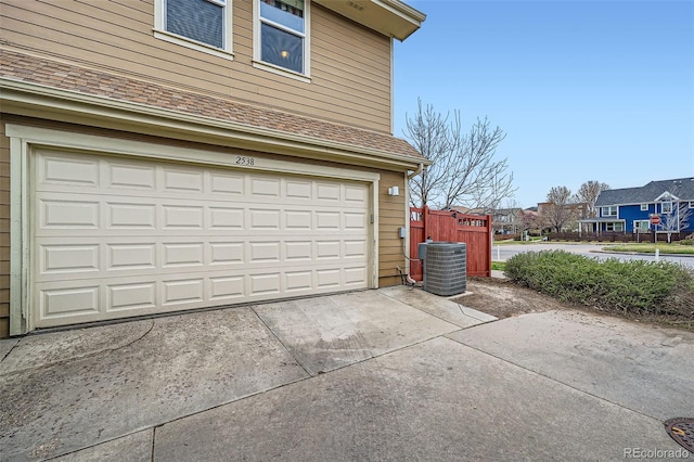 2538 Central Park Blvd, Denver, CO 80238 - garage with concrete driveway and a residential view