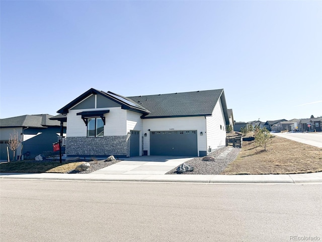 view of front facade with a garage, concrete driveway, and brick siding