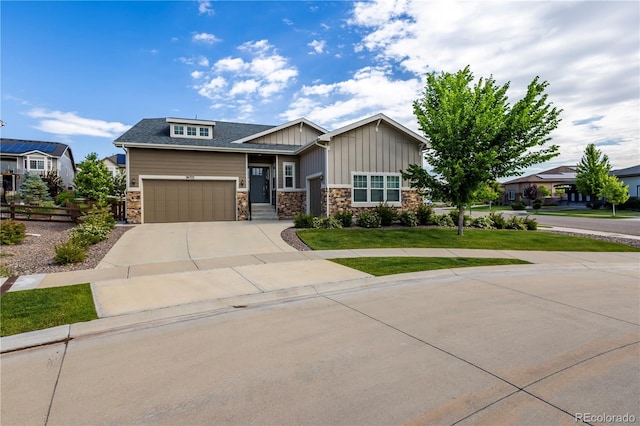 26722 E Peakview Pl, Aurora, CO 80016 - craftsman-style house featuring board and batten siding, stone siding, concrete driveway, and a front lawn