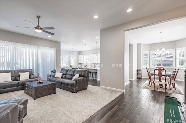 26722 E Peakview Pl, Aurora, CO 80016 - living room with dark wood-style flooring, a chandelier, ceiling fan, plenty of natural light, and recessed lighting