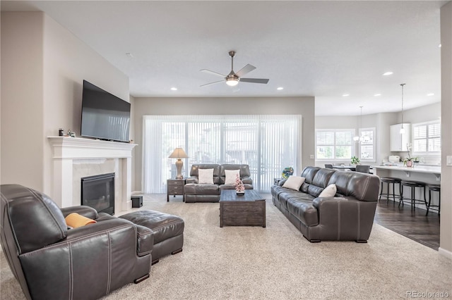 26722 E Peakview Pl, Aurora, CO 80016 - carpeted living area with a ceiling fan, recessed lighting, and a glass covered fireplace