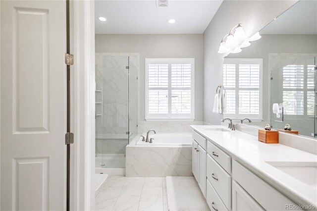 26722 E Peakview Pl, Aurora, CO 80016 - bathroom featuring a bath, double vanity, a stall shower, marble finish floors, and recessed lighting