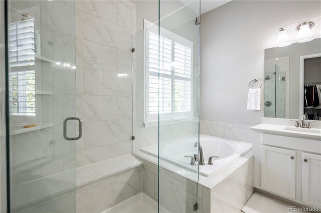 26722 E Peakview Pl, Aurora, CO 80016 - bathroom with a bath, vanity, a stall shower, and plenty of natural light