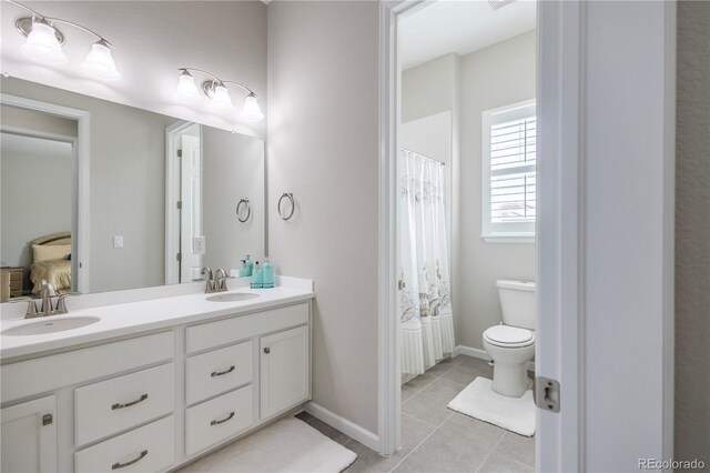 26722 E Peakview Pl, Aurora, CO 80016 - full bathroom with double vanity, tile patterned flooring, and ensuite bathroom