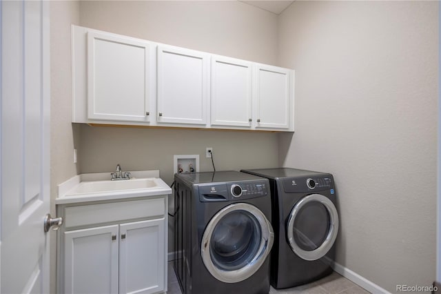 26722 E Peakview Pl, Aurora, CO 80016 - washroom with cabinet space, washer and clothes dryer, and light tile patterned floors