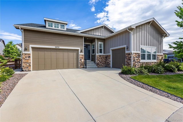 26722 E Peakview Pl, Aurora, CO 80016 - craftsman-style home featuring a garage, board and batten siding, stone siding, and concrete driveway