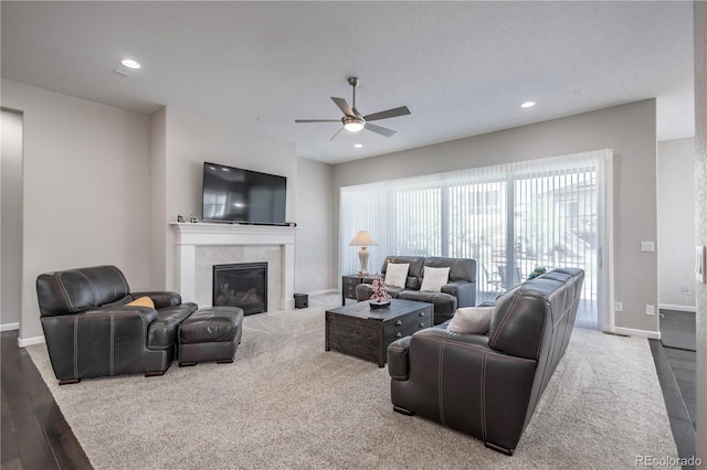 26722 E Peakview Pl, Aurora, CO 80016 - carpeted living room with ceiling fan, a tile fireplace, recessed lighting, and wood finished floors