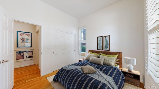 6187 Reed Way, Arvada, CO 80003 - bedroom featuring light wood-type flooring and a closet