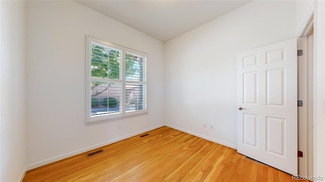 6187 Reed Way, Arvada, CO 80003 - spare room featuring light wood-style flooring and baseboards