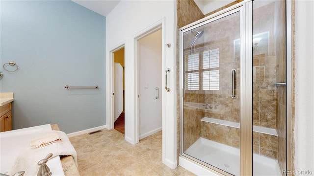 6187 Reed Way, Arvada, CO 80003 - bathroom with vanity and a stall shower