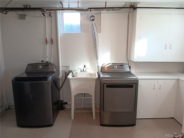 laundry area with independent washer and dryer