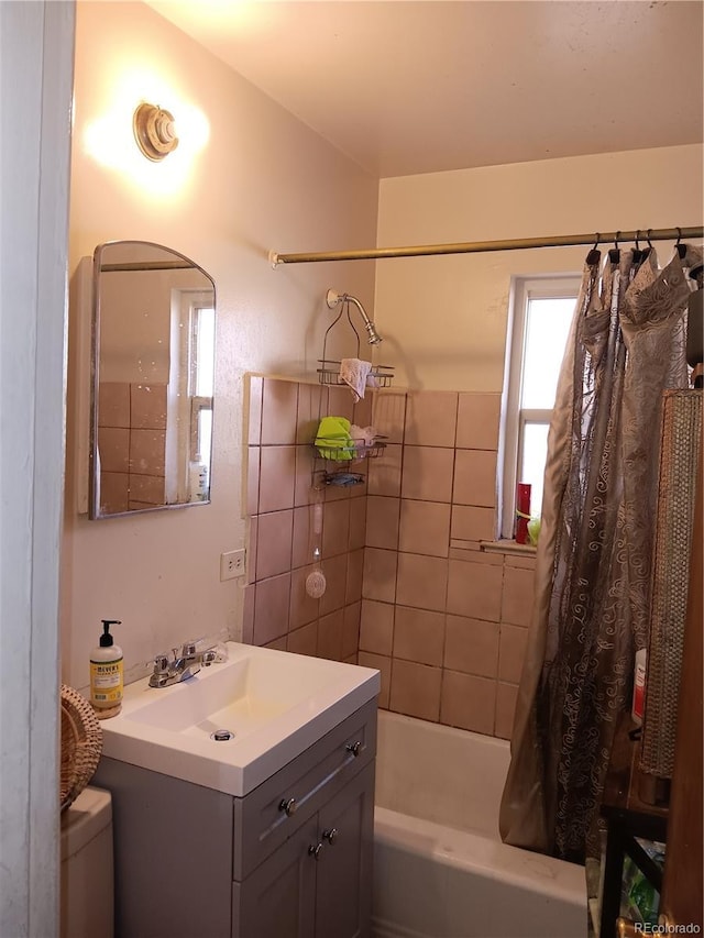 bathroom featuring vanity and shower / tub combo