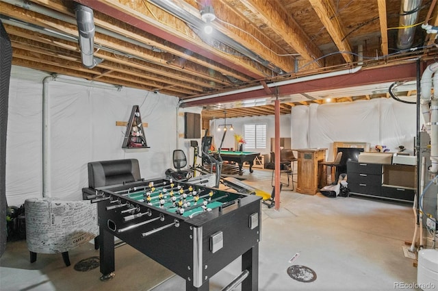 rec room with pool table and concrete flooring