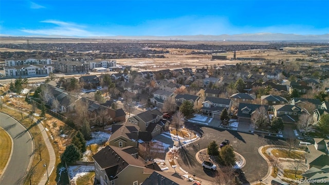 birds eye view of property with a mountain view