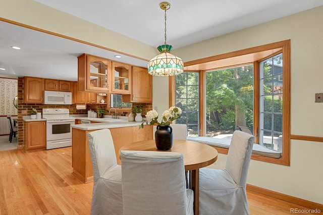 8277 Teller Ct, Arvada, CO 80003 - dining space featuring light wood finished floors and recessed lighting