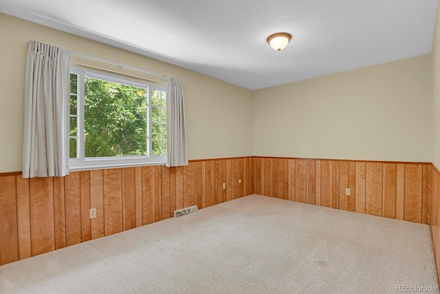 8277 Teller Ct, Arvada, CO 80003 - spare room with carpet flooring, wood walls, and wainscoting